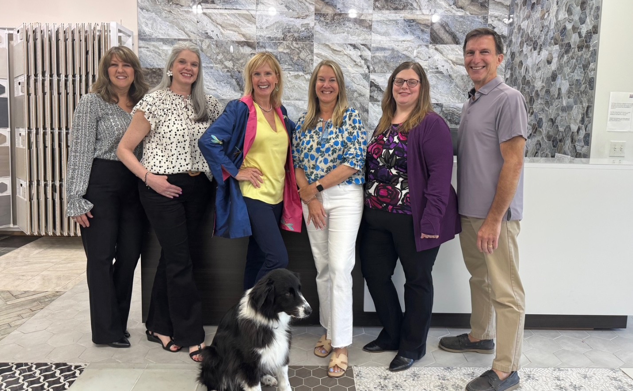 The flooring expert staff at Peck's Flooring America! Including Phoenix, the showroom dog!